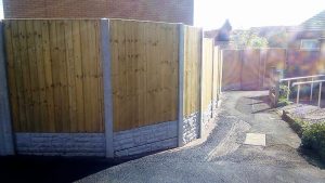 wooden fence with concrete posts