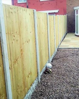 wooden fence with concrete posts